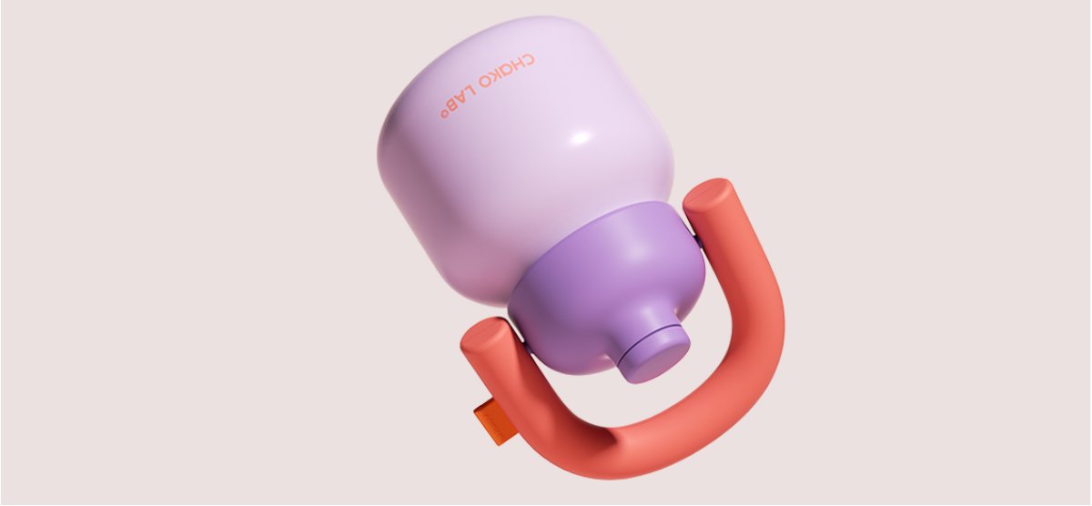 Lilac Chako Lab ergonomic cup with a coral handle on a soft pink background