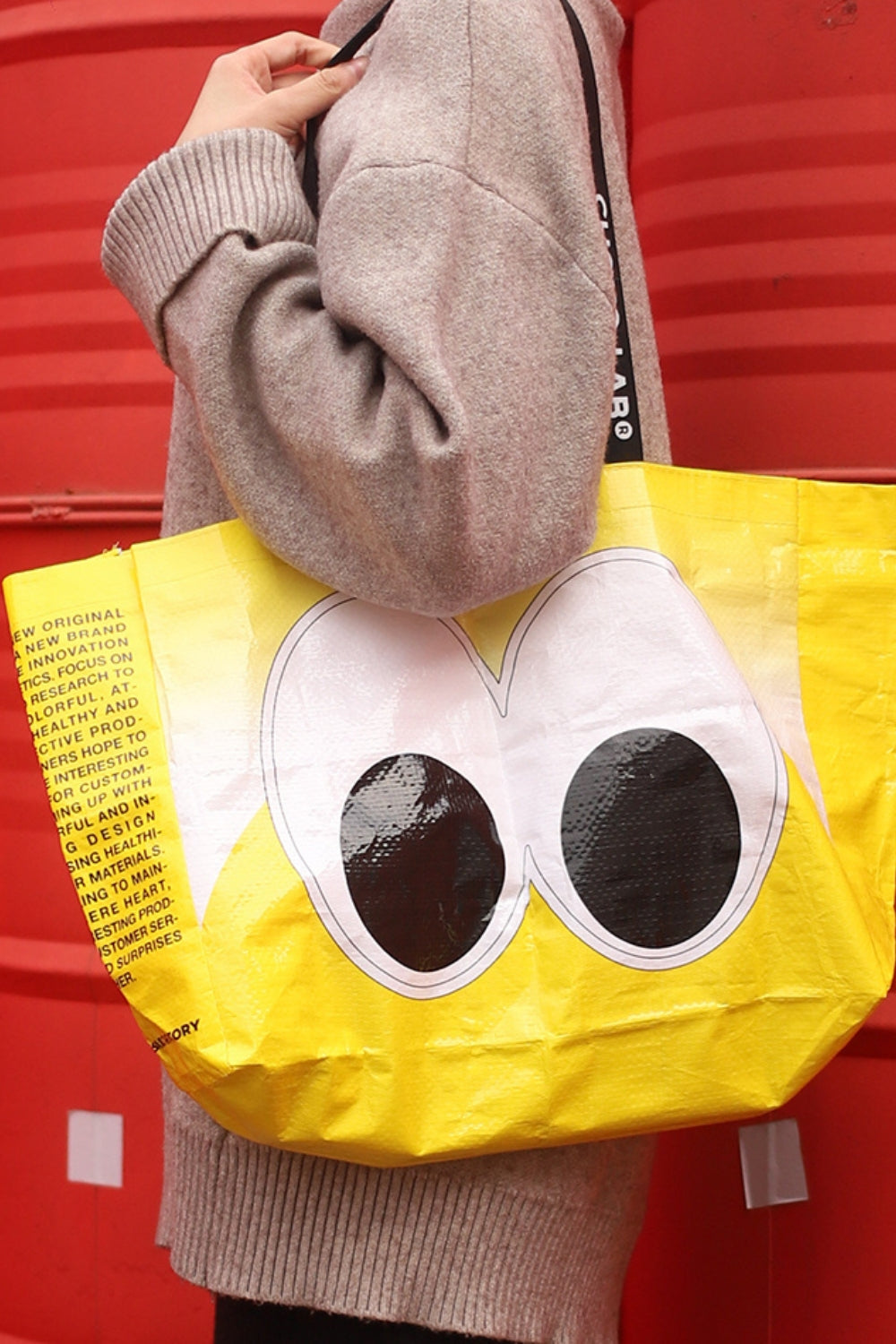 Chako Reusable Bag Peekaboo eyes tote against red